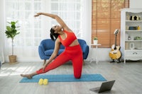 a woman doing yoga in her living room