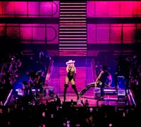 britney spears performs on stage in front of a crowd of people