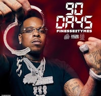 a man holding a handcuff in front of a red background