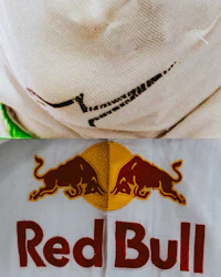a picture of a red bull logo on a white shirt