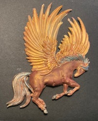 a statue of a horse with wings on it