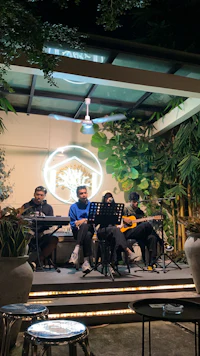 a group of people playing music on a stage