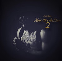 a man with tattoos and a tattoo on his arm