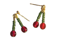 a pair of earrings with red and green beads