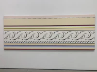 a white wall with a painting on it