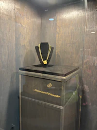 a hat is on display in a glass case