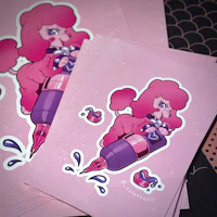 a stack of pink stickers with a pink poodle on them