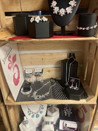 a display of jewelry in a wooden crate