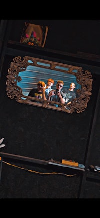 a mirror with a picture of a group of people