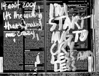 a black and white photo of a book with graffiti on it