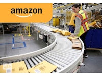 a woman is standing on a conveyor belt in an amazon warehouse