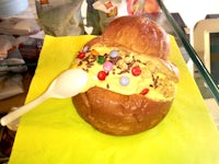 an ice cream sandwich on a plate with a spoon