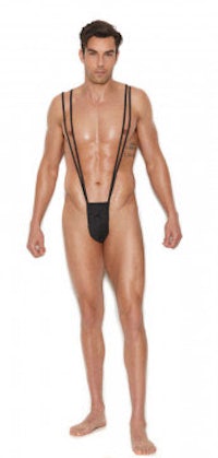 a man in a black thong posing in front of a white background