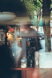a person sitting at a table in a restaurant