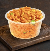 a plastic container filled with rice and peas