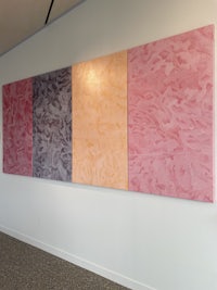 a piece of art hanging on a wall