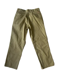 a pair of khaki pants on a black background