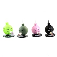 a set of four different colored bombs on top of a black base