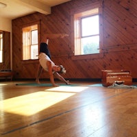 a person doing a yoga pose in a room