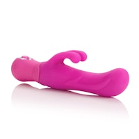 a pink sex toy on a white surface