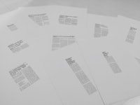 a stack of white papers with text printed on them