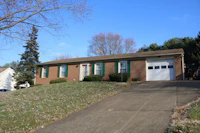 a brick house on a hill
