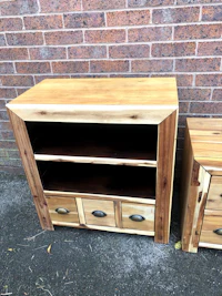 a wooden tv stand with two drawers