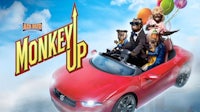 monkey up is a movie with a red car and a group of people in it