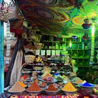 a colorful display of spices at a market in morocco