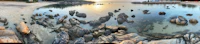 a 360 degree view of a beach with rocks and water