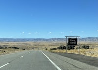 a highway with a sign in the middle of the road