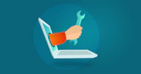 a hand holding a wrench on a laptop