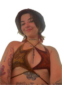 a woman in a bikini with tattoos and a hat