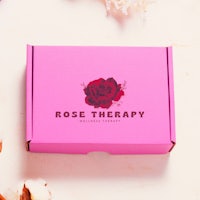 a pink box with the words rose therapy on it