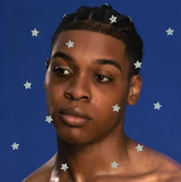 a young man with stars on his chest