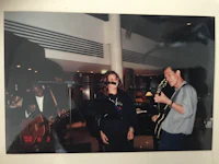 an old photo of a man and a woman playing guitar