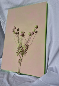 a pink piece of paper with flowers on it