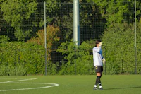a person standing on a soccer field