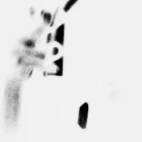 a black and white photo of a person holding a phone