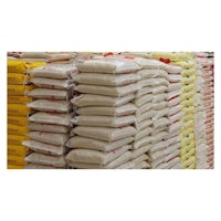 many bags of rice are stacked in a warehouse