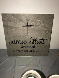 a memorial plaque with the name jamie elliott