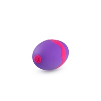 a purple and pink ball on a white surface