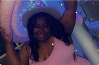a black woman in a pink dress posing for a photo