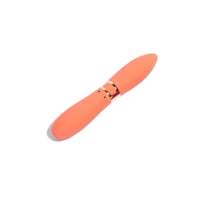 a pink sex toy on a white surface