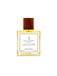 a bottle of uden perfume on a black background