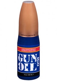 a bottle of gun oil on a white background