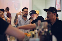 a group of people drinking at a bar