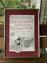 a framed piece of art with a poem on it