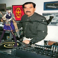 a man in front of a dj booth with an anime character