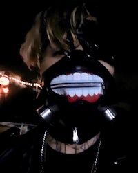 a person wearing a mask with teeth on it